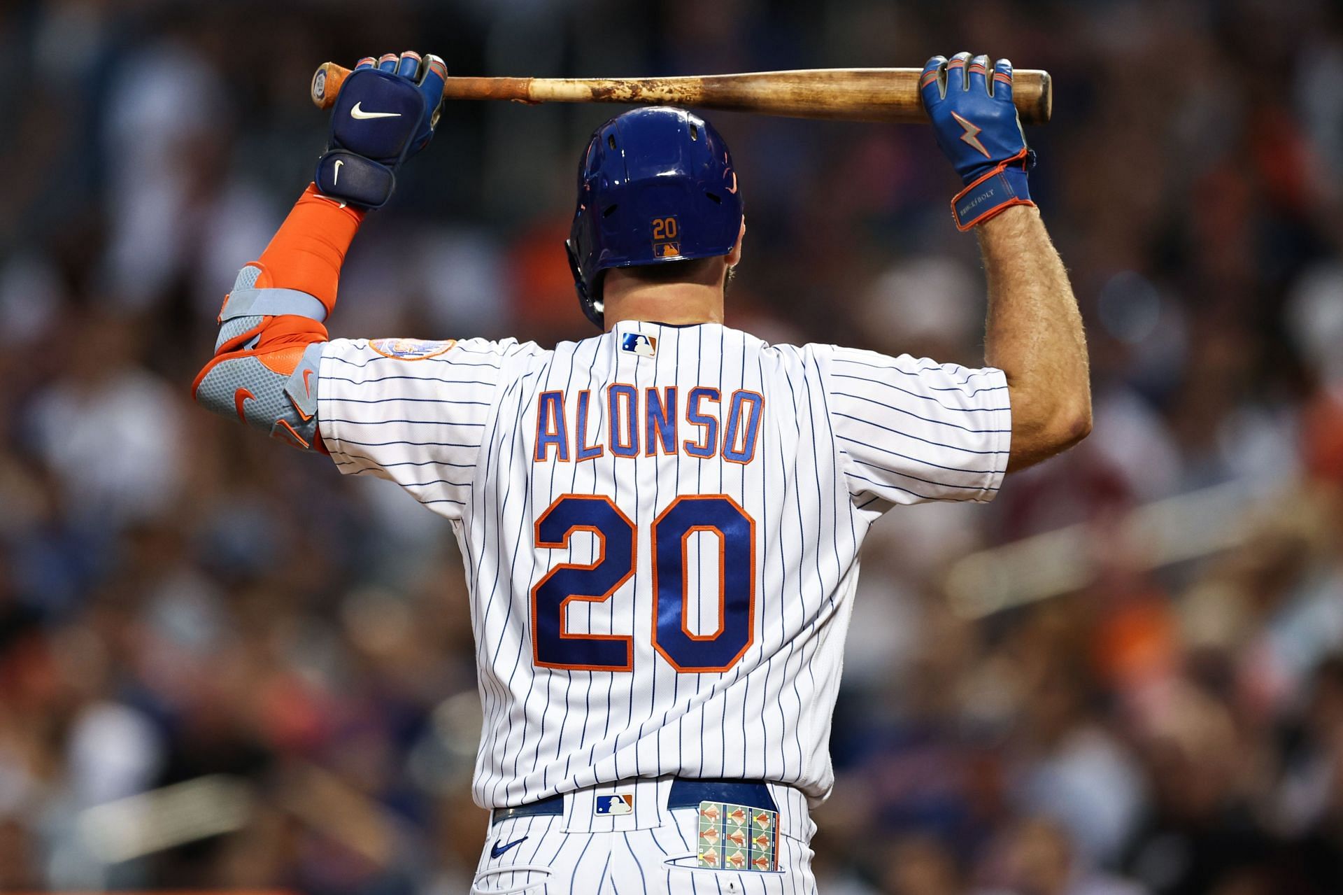 Pete Alonso puts his bat over his head in frustration after tonight's frustrating loss to the Milwaukee Brewers.
